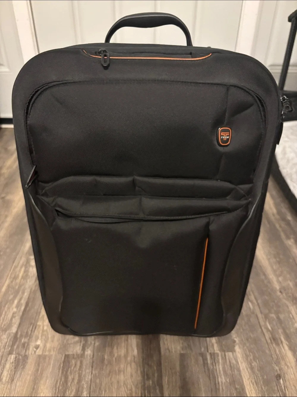 Tumi Black Carry-On Wheelaway with Orange Trim